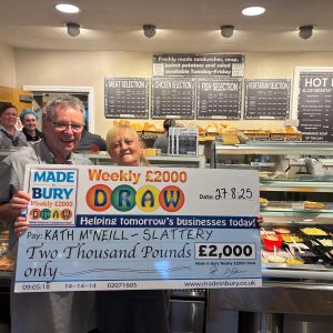Kath McNeill, Slattery Sales Assistant, celebrating winning £2,000 in the Made In Bury Weekly Draw